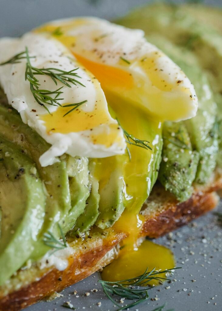 Egg Yolk Oozing from Sliced Poached Egg